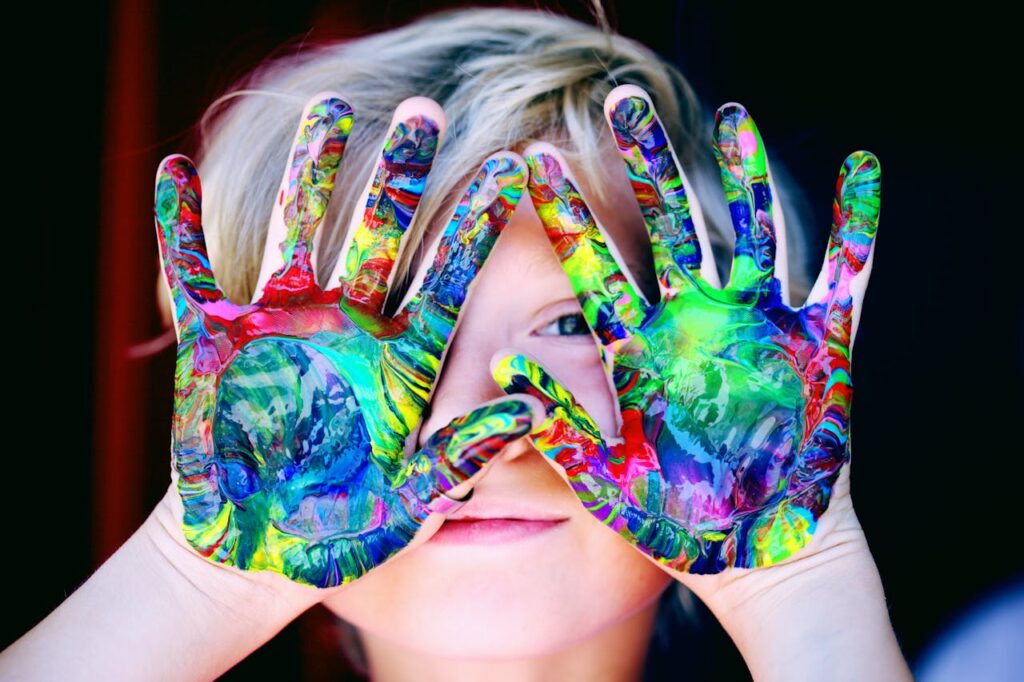 pexels-photo-1148998 A KId With Multicolored Hand Paint